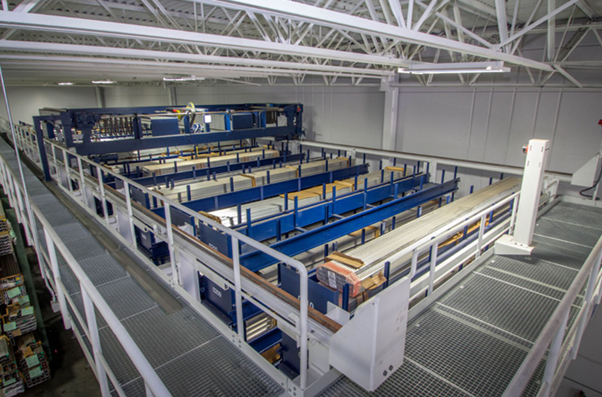 Picture: A traversing storage and retrieval machine stores and retrieves the cassettes in the twelve aisles of the long goods store.